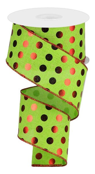 a roll of green and orange polka dot ribbon