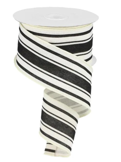 A spool of black and white striped ribbon is shown against a white background.
