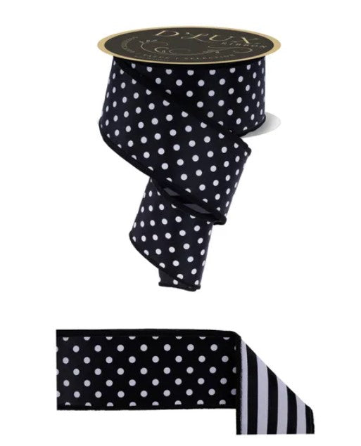 a black and white polka dot ribbon with a gold label.