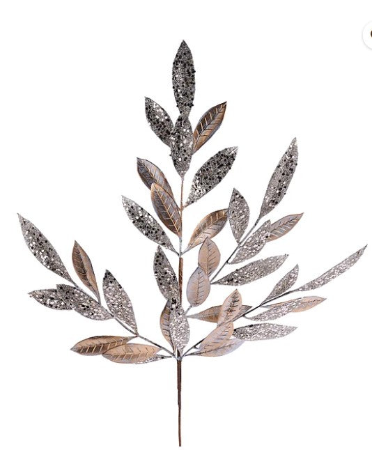 a decorative leaf-like object with a metallic, glittery appearance.