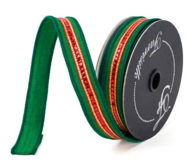 A spool of green, red, and gold ribbon with a black and white logo on it.