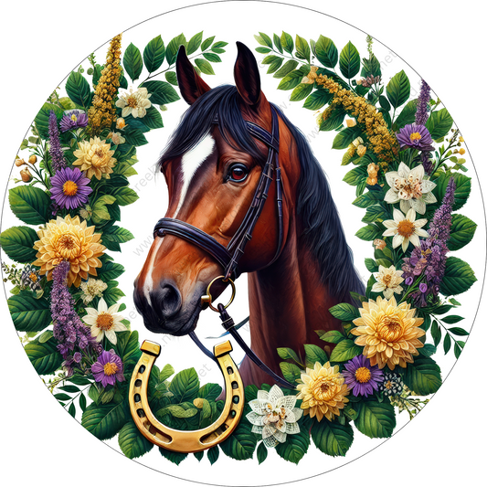 A brown horse with a white blaze is surrounded by a wreath of colorful flowers and leaves, with a horseshoe in the center.