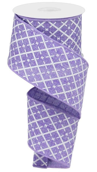 a roll of purple and white patterned ribbon