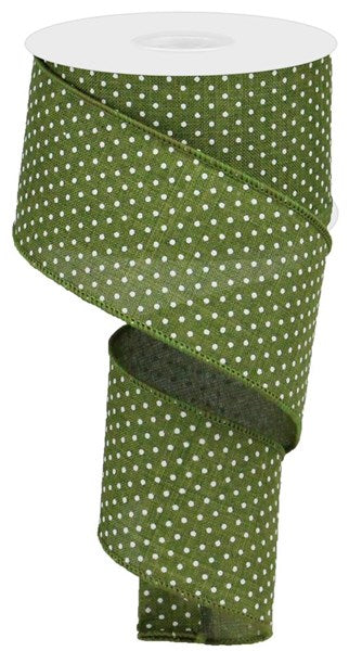 a roll of green and white polka dot ribbon