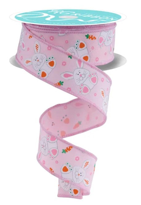 A pink ribbon with a repeating pattern of white rabbits and carrots printed on it.