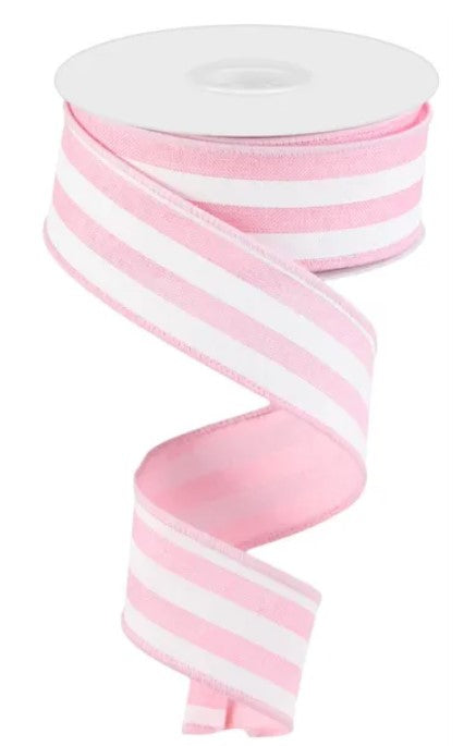 A spool of pink and white striped ribbon is shown against a white background.