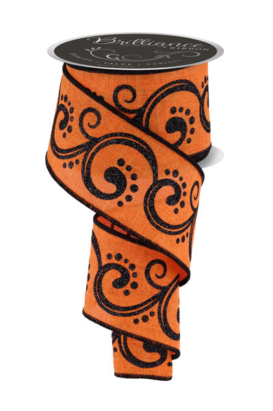 a roll of orange and black ribbon on a white background