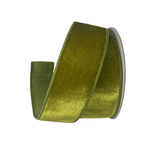 A roll of green velvet ribbon with a shiny, textured appearance.