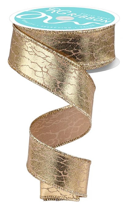 a gold-colored metallic ribbon with a textured pattern, hanging in a spiral shape.