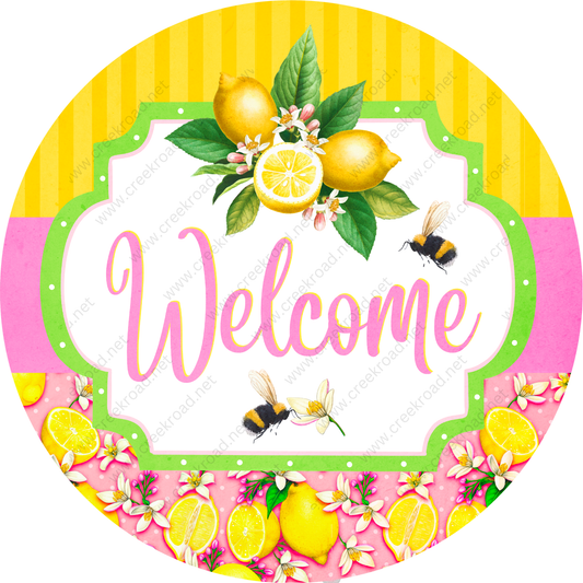 A colorful welcome sign with a lemon and bumble bee design, surrounded by flowers and lemons.