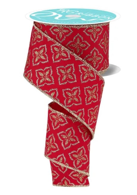 a red and gold floral patterned ribbon.