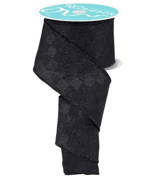 a black checkered pattern ribbon with a turquoise label.