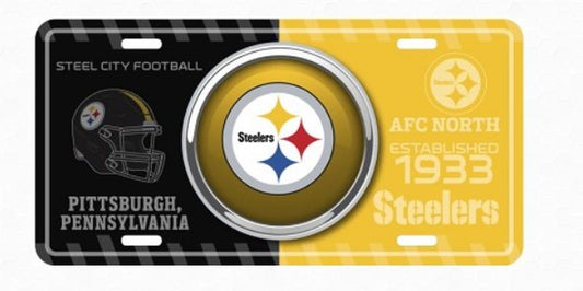 A license plate featuring the Pittsburgh Steelers logo and text, with a black background on the left and a yellow background on the right.