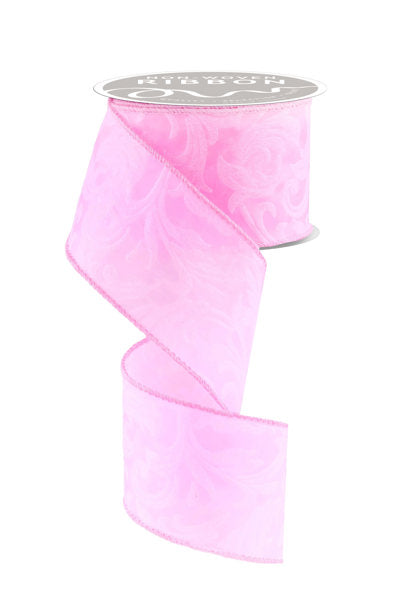 a roll of pink organ organ ribbon on a white background