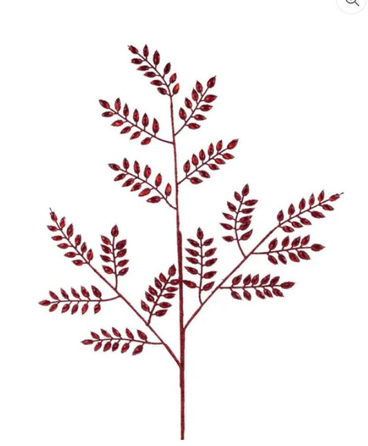 a red branch with numerous small leaves, creating a striking visual effect.