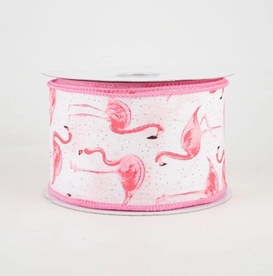 a pink and white ribbon with flamingos on it