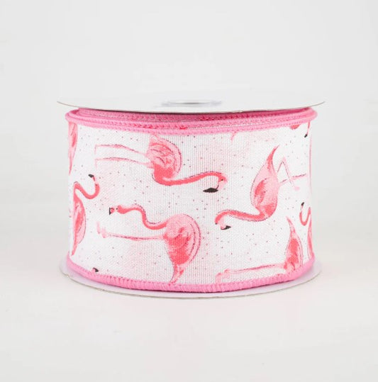a pink and white ribbon with flamingos on it