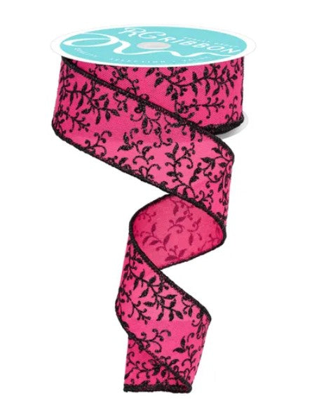 A pink floral patterned ribbon with black leaf designs.