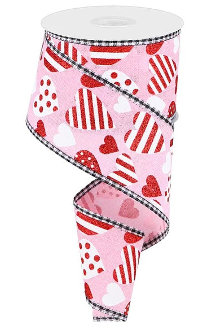 A pink and white heart-shaped ribbon with a black and white checkered border.