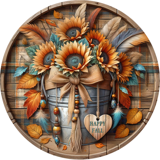 A round wooden barrel filled with a vibrant arrangement of sunflowers, feathers, and autumn leaves, creating a festive and seasonal display.