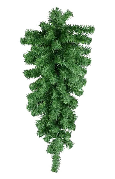A tall, green Christmas tree with numerous branches and needles.