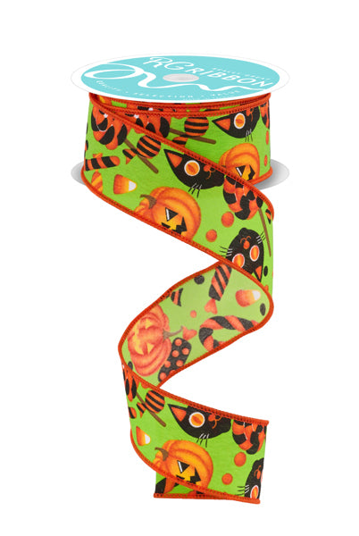 a spool of green and orange halloween ribbon