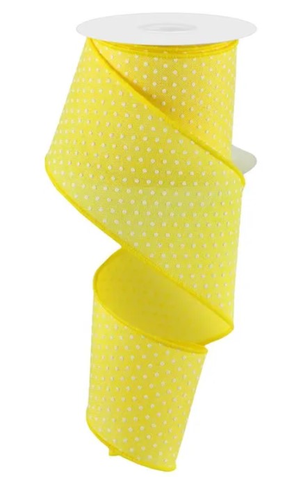A yellow ribbon with white polka dots, coiled and ready for use.