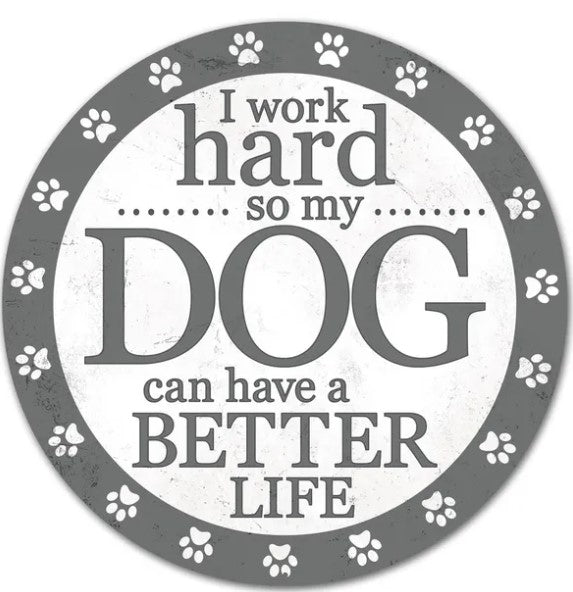 a circular design with a central message that reads "I work hard so my dog can have a better life". The design is surrounded by paw prints, creating a playful and whimsical atmosphere.