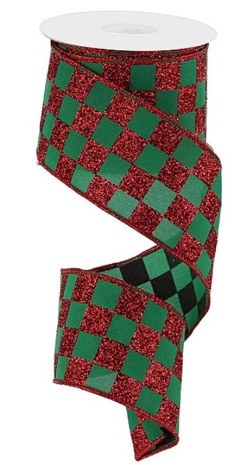 A roll of red and green checkered ribbon with a glittery texture.