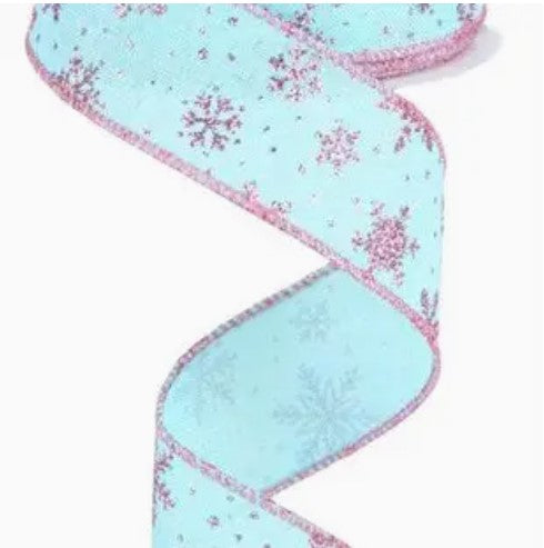 a pink and blue ribbon with snowflakes on it