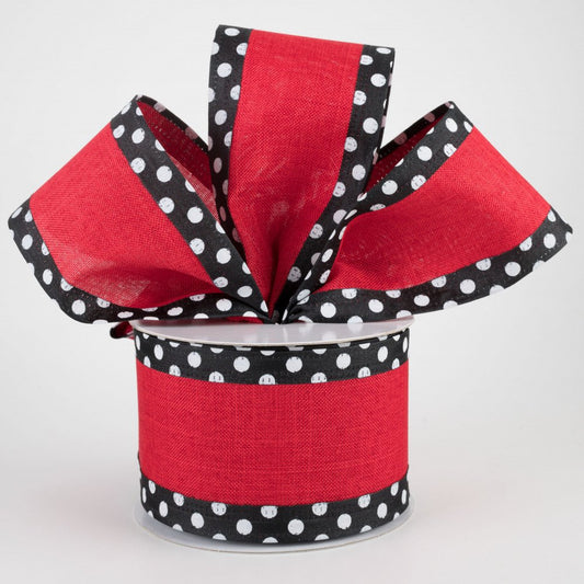 a roll of red and black polka dot ribbon