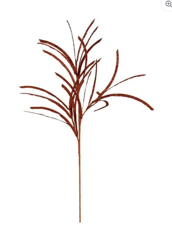 A single, brown, spiky plant stem with long, thin leaves.