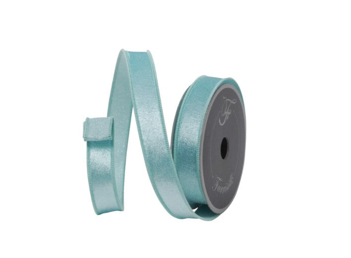 A roll of turquoise ribbon with a silver buckle, displayed against a white background.