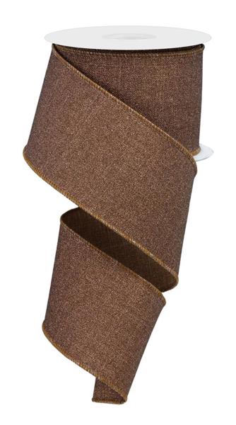 a brown, textured fabric ribbon with a scalloped edge, which appears to be a decorative item.