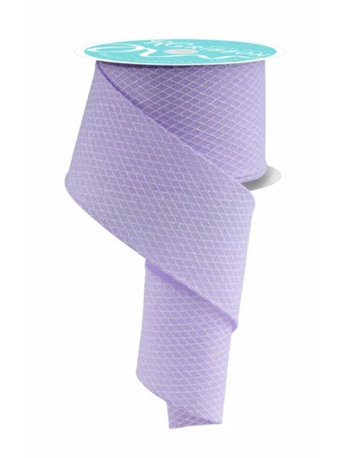 A roll of purple ribbon with a teal label on top.