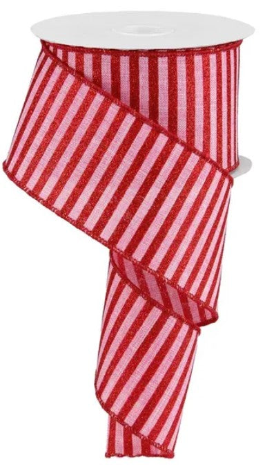 A roll of red and pink striped ribbon.