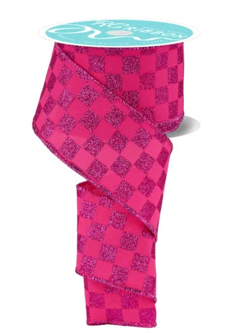 A pink and black checkered ribbon with a turquoise label on top.