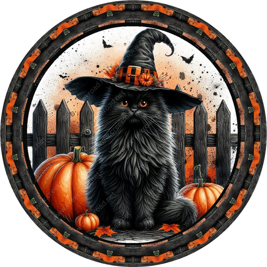 a picture of a black cat wearing a witches hat
