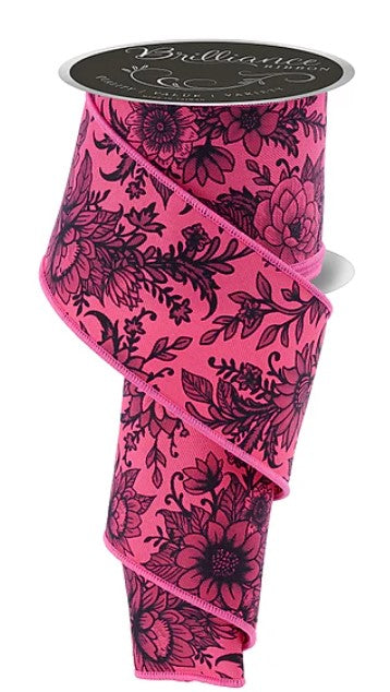 A pink floral patterned ribbon is shown, with a black and white floral design on it.