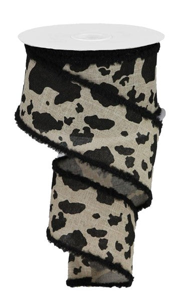 a roll of black and white patterned fabric