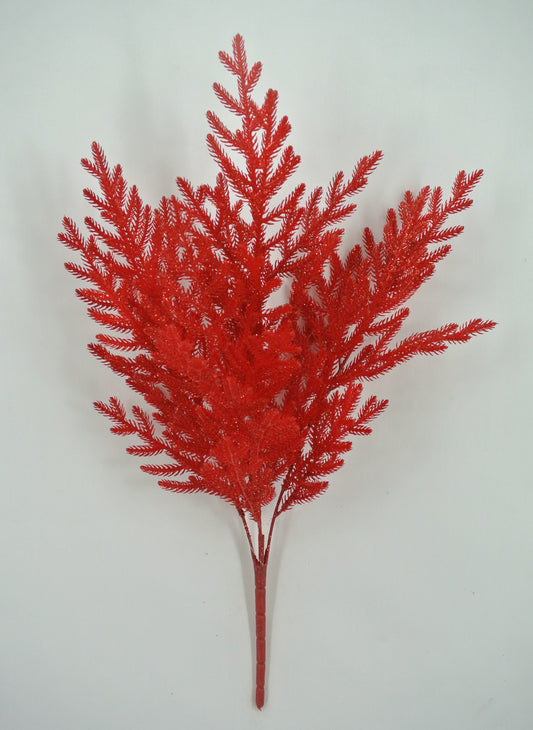 A red artificial plant with multiple branches and leaves, resembling a small tree or plant.