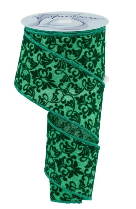 a green and black floral patterned ribbon.