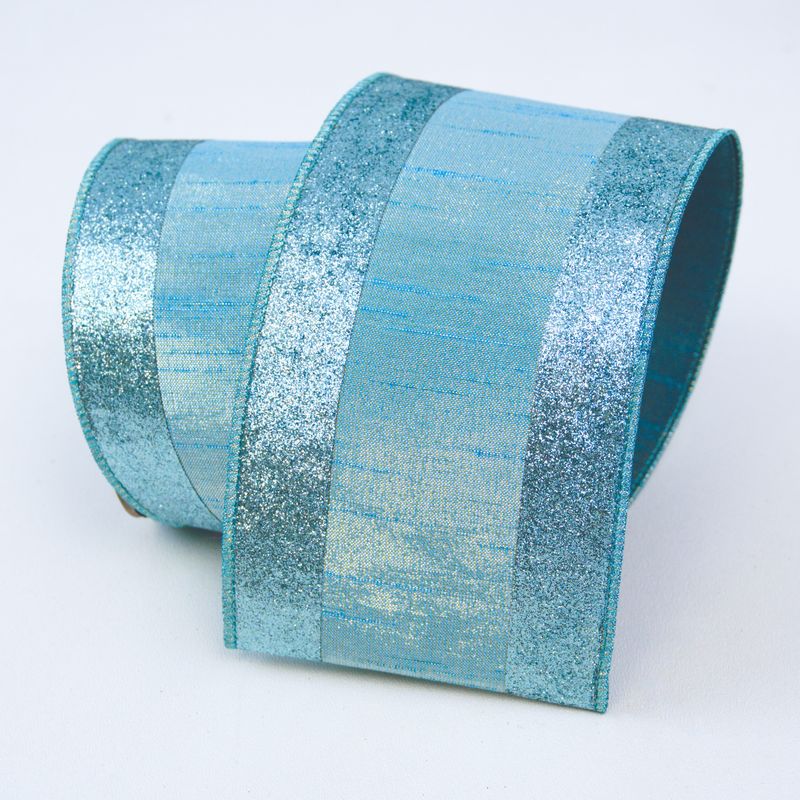 a roll of blue glitter tape on a white background