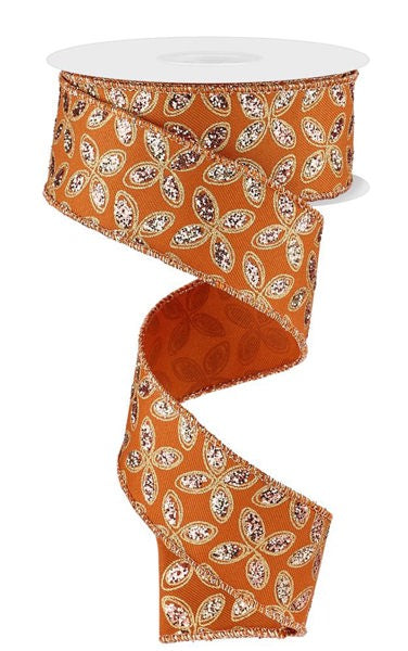 a decorative orange and white floral patterned ribbon.
