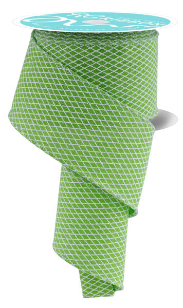 a roll of green and white patterned ribbon.