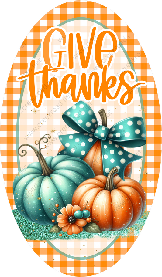 a thanksgiving card with pumpkins and a bow