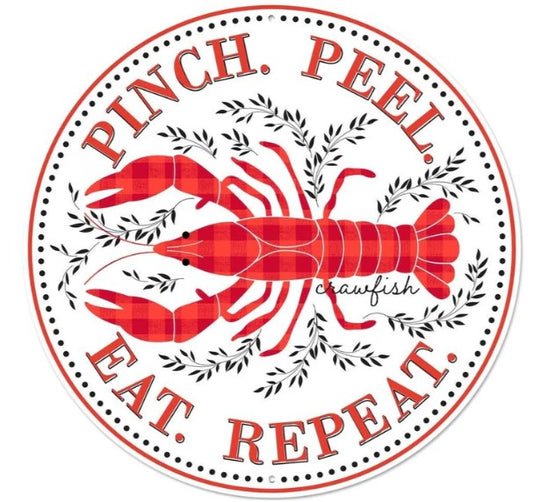 A red and white circular sign with the text "Pinch. Peel. Eat. Repeat." and an illustration of a red lobster.