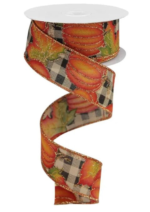 A spiral-shaped ribbon with a pattern of orange pumpkins and green leaves on a white background.