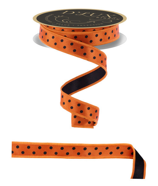 a roll of orange and black polka dot ribbon
