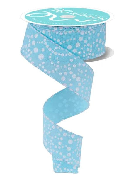 A turquoise and white polka dot ribbon is shown, with the ribbon winding around itself in a spiral pattern.